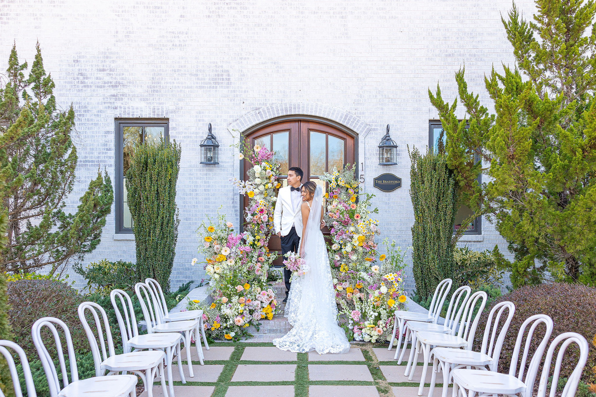 Wedding Portrait with bright florals outside venue