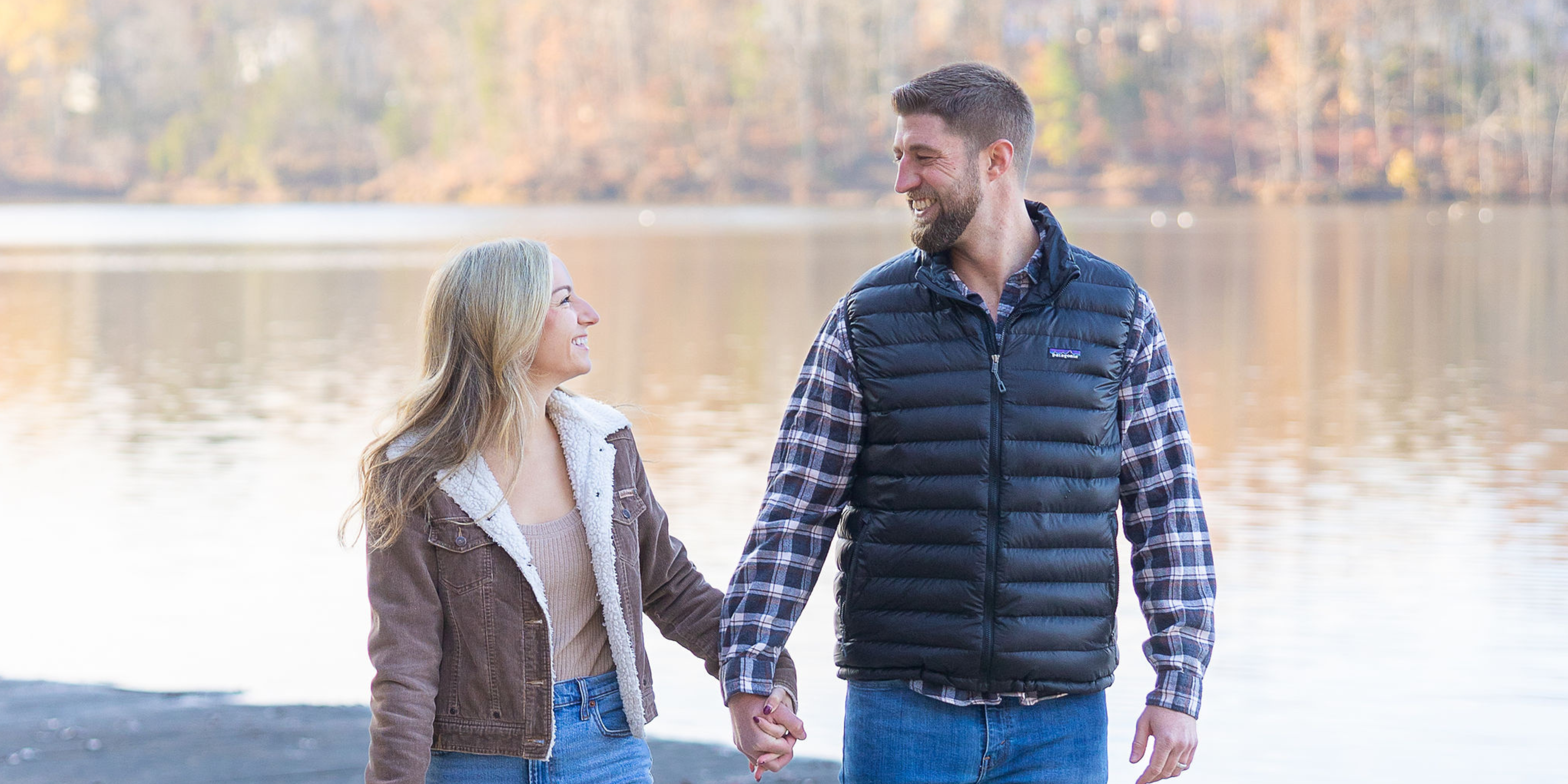 Couple Walking at a Lake in the Fall