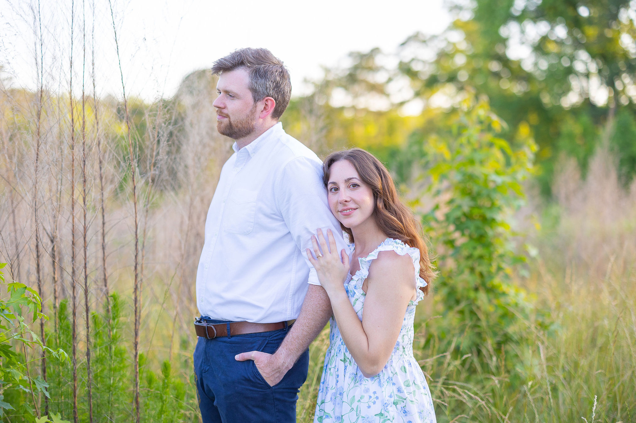 Couple in field for engagement shoot