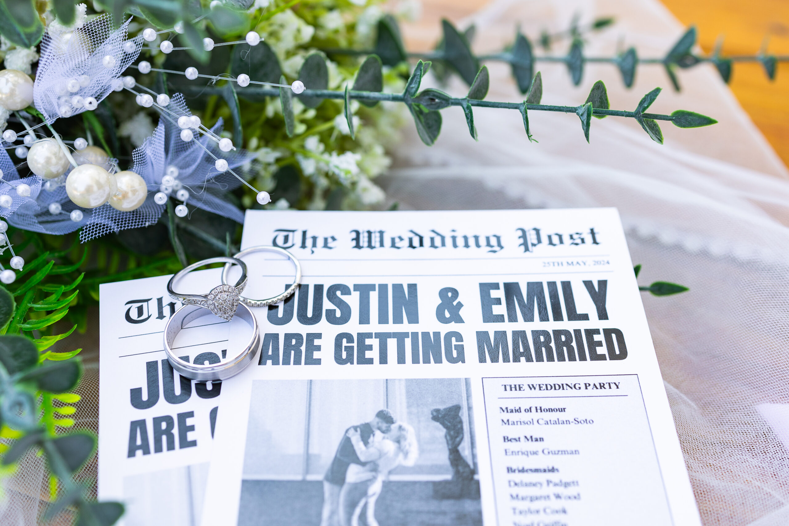 Custom wedding newspaper with wedding rings sitting on top of it