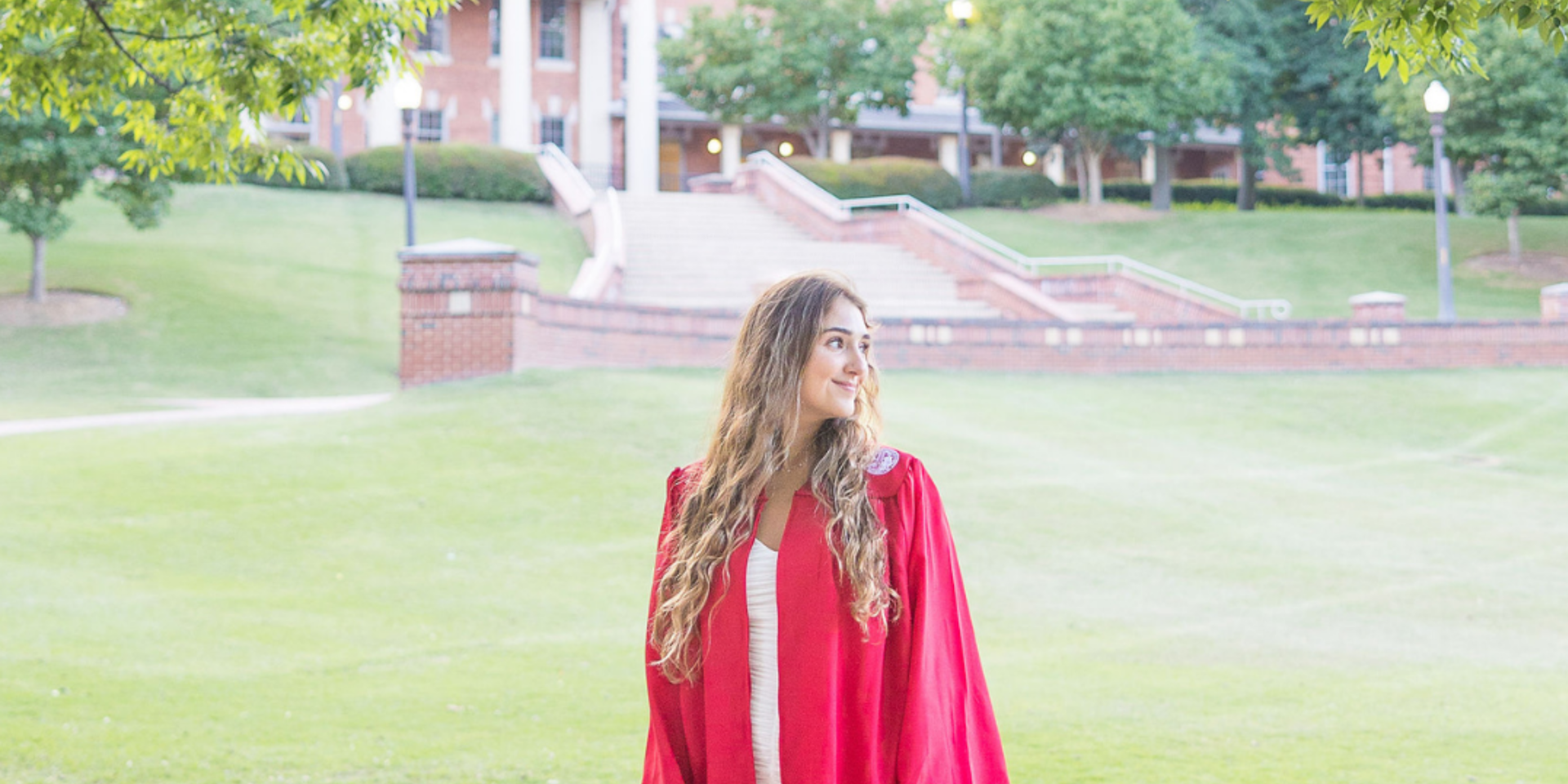 Girl looking to the side in an open field at NC States Court of Carolina