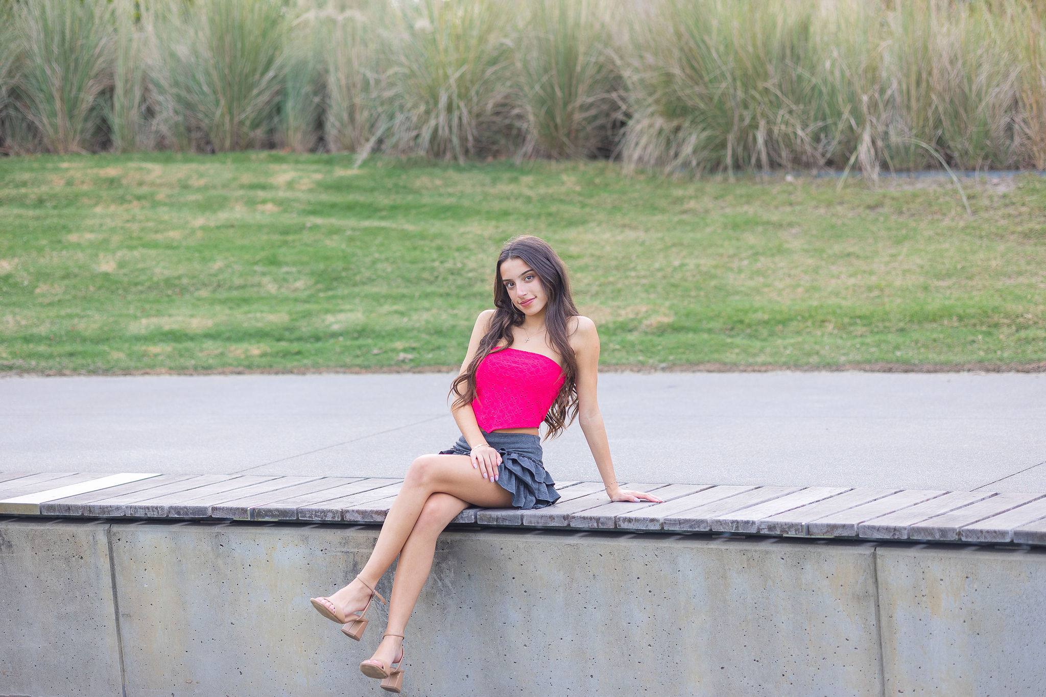 Girl sitting in pink top