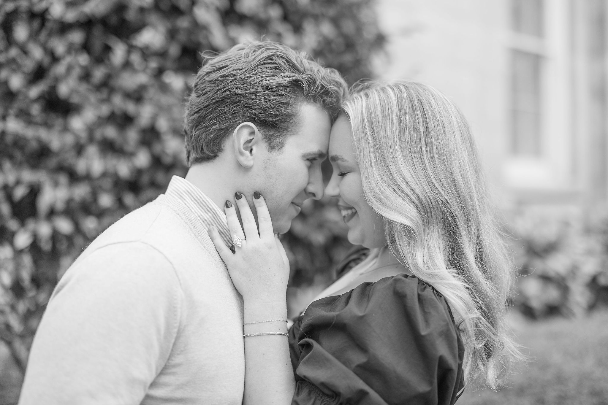 Black and White photo of a couple with their heads touching