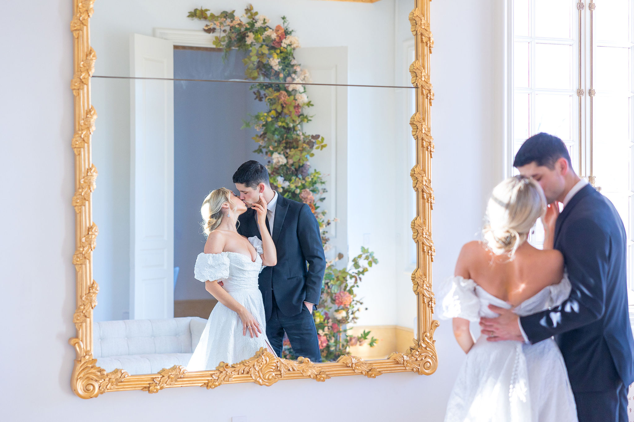 Bride and Groom Kissing and looking into a mirror