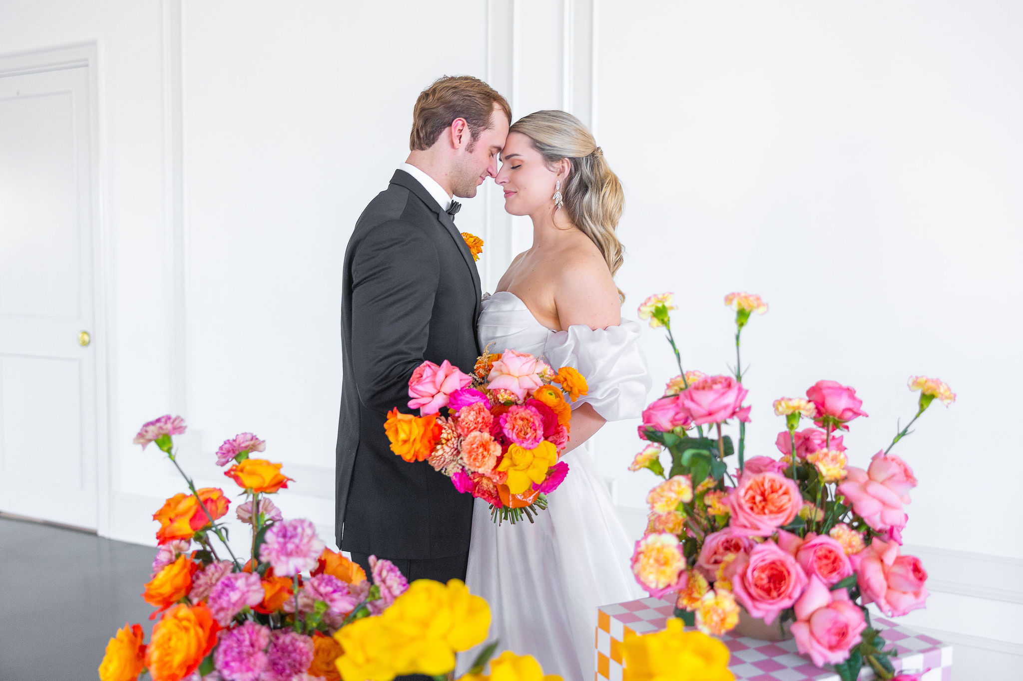 Bride and Groom with colorful flowers