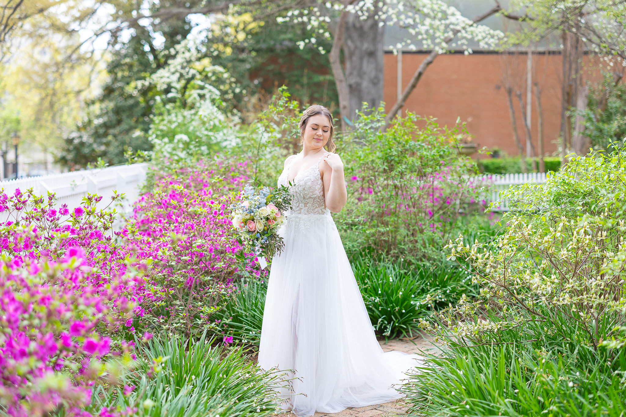 Bride in garden with pink and green flowers