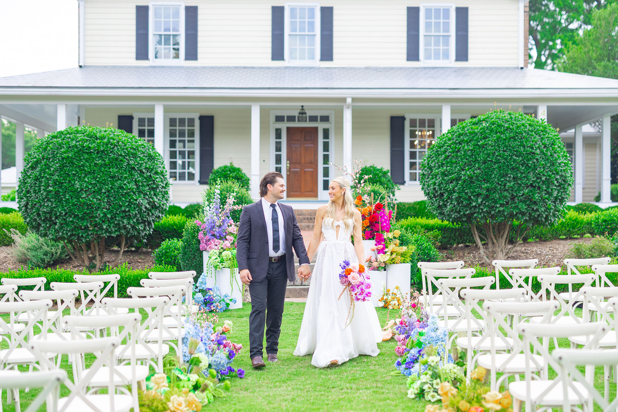 Colorful wedding in Raleigh NC, Bride and Groom walking down the isle