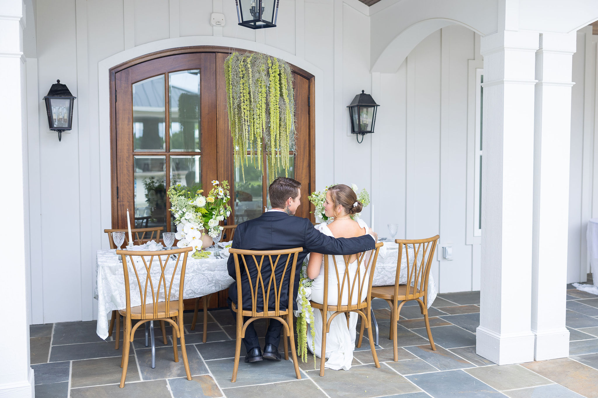 Bride & Groom Sitting at Table at Wedding