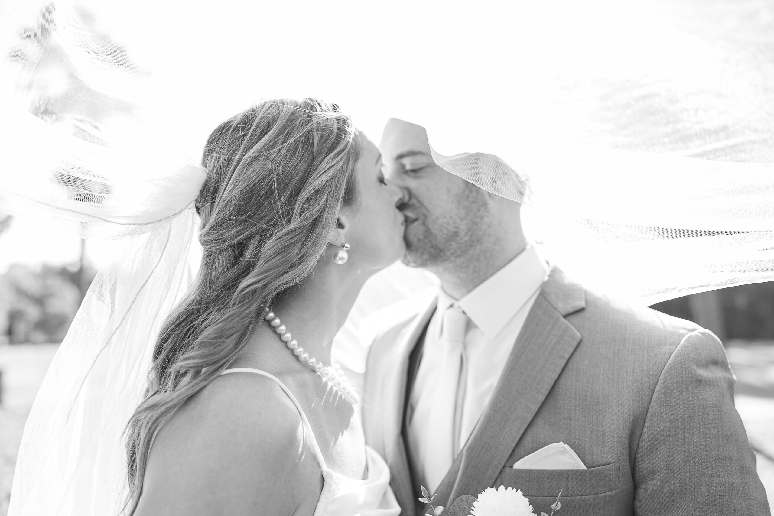 Black and White Picture of Bride and Groom Kissing