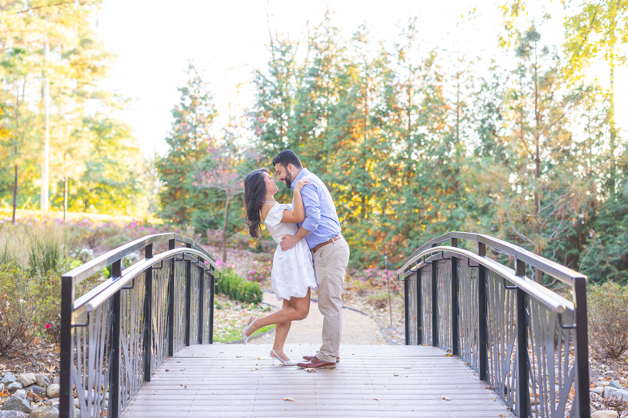 couple on bridge at park