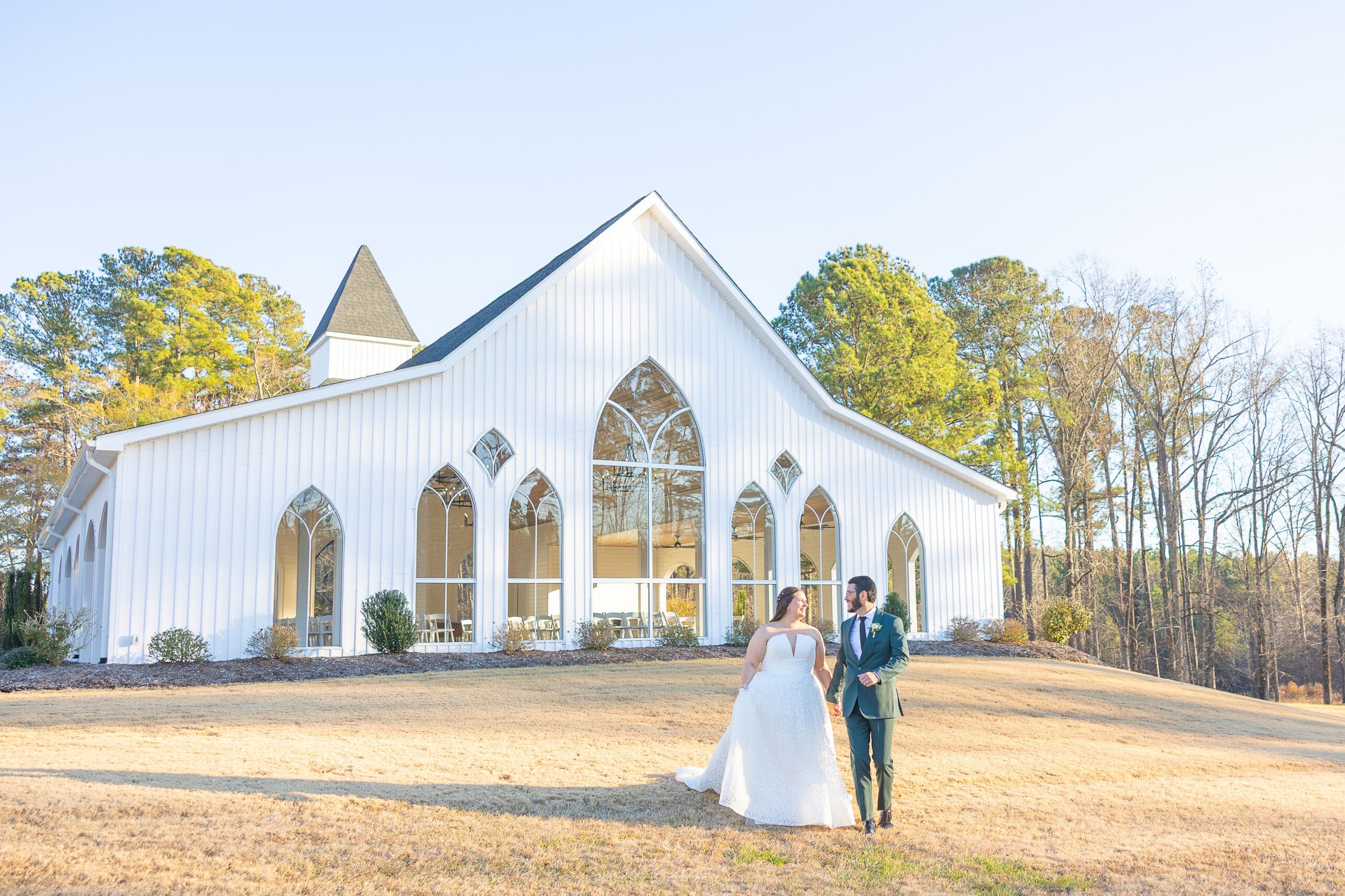 bride and groom outside of the wedding venue