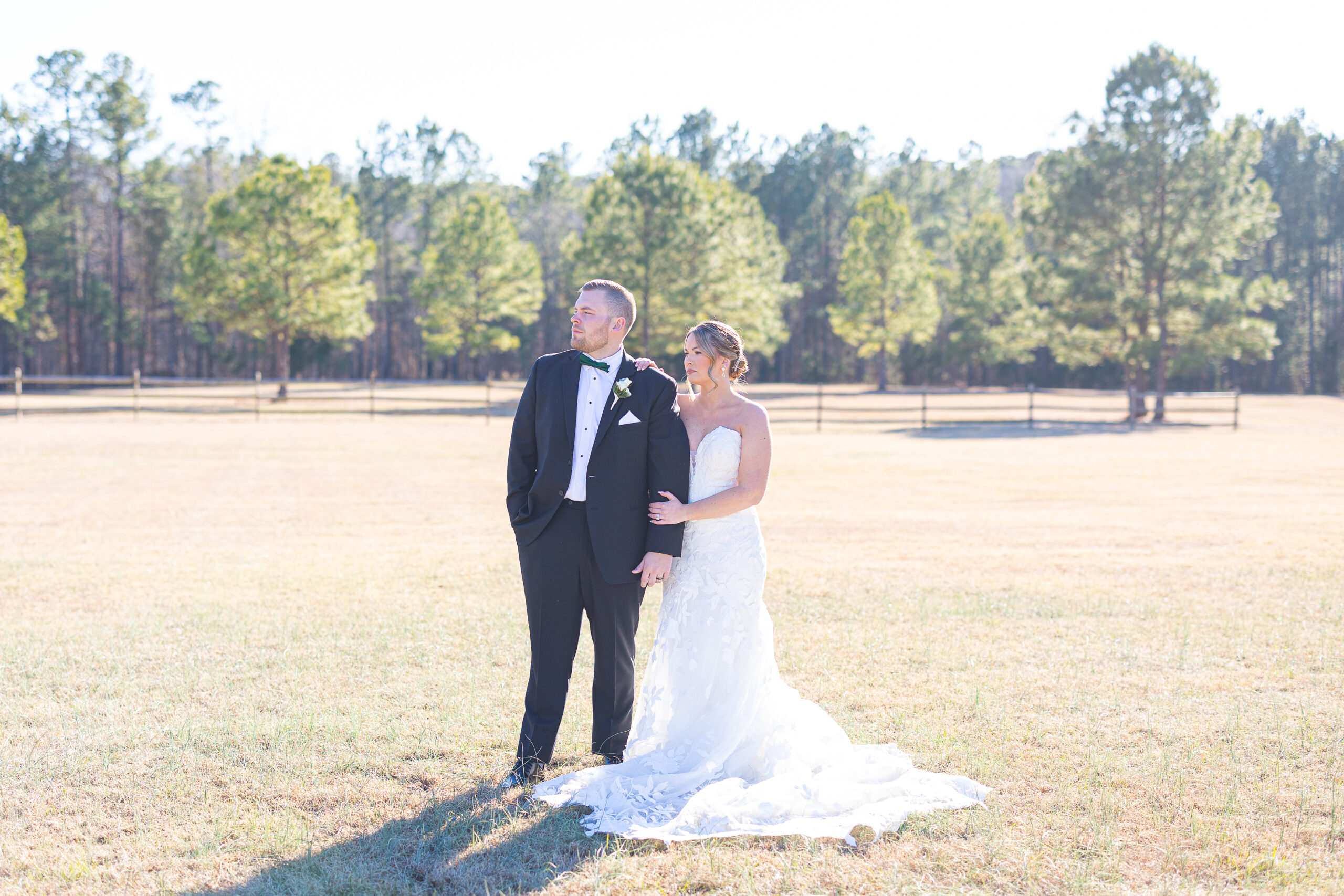 bride and groom in field