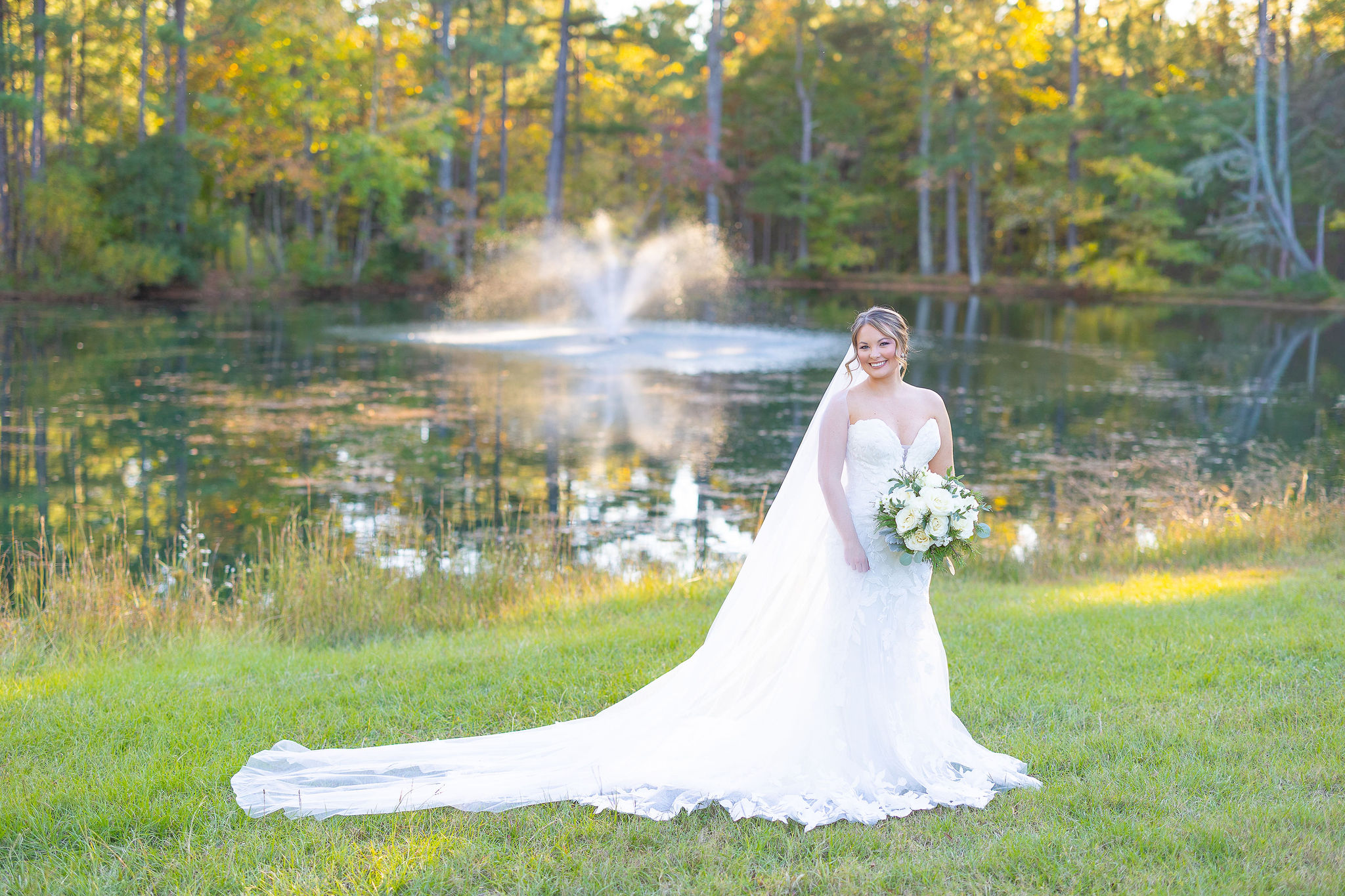 bride in front of pond and fountain