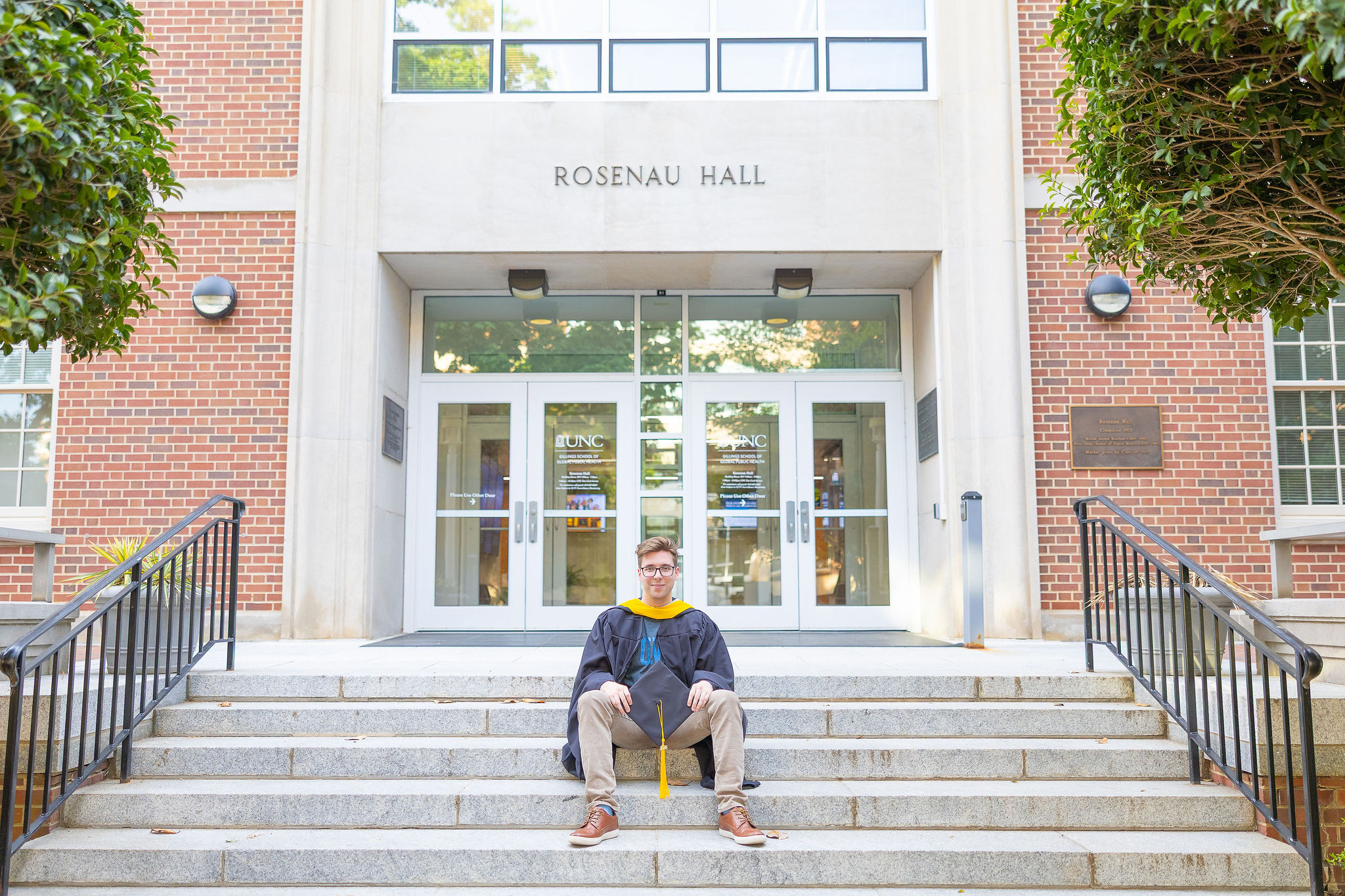UNC Senior sitting on steps