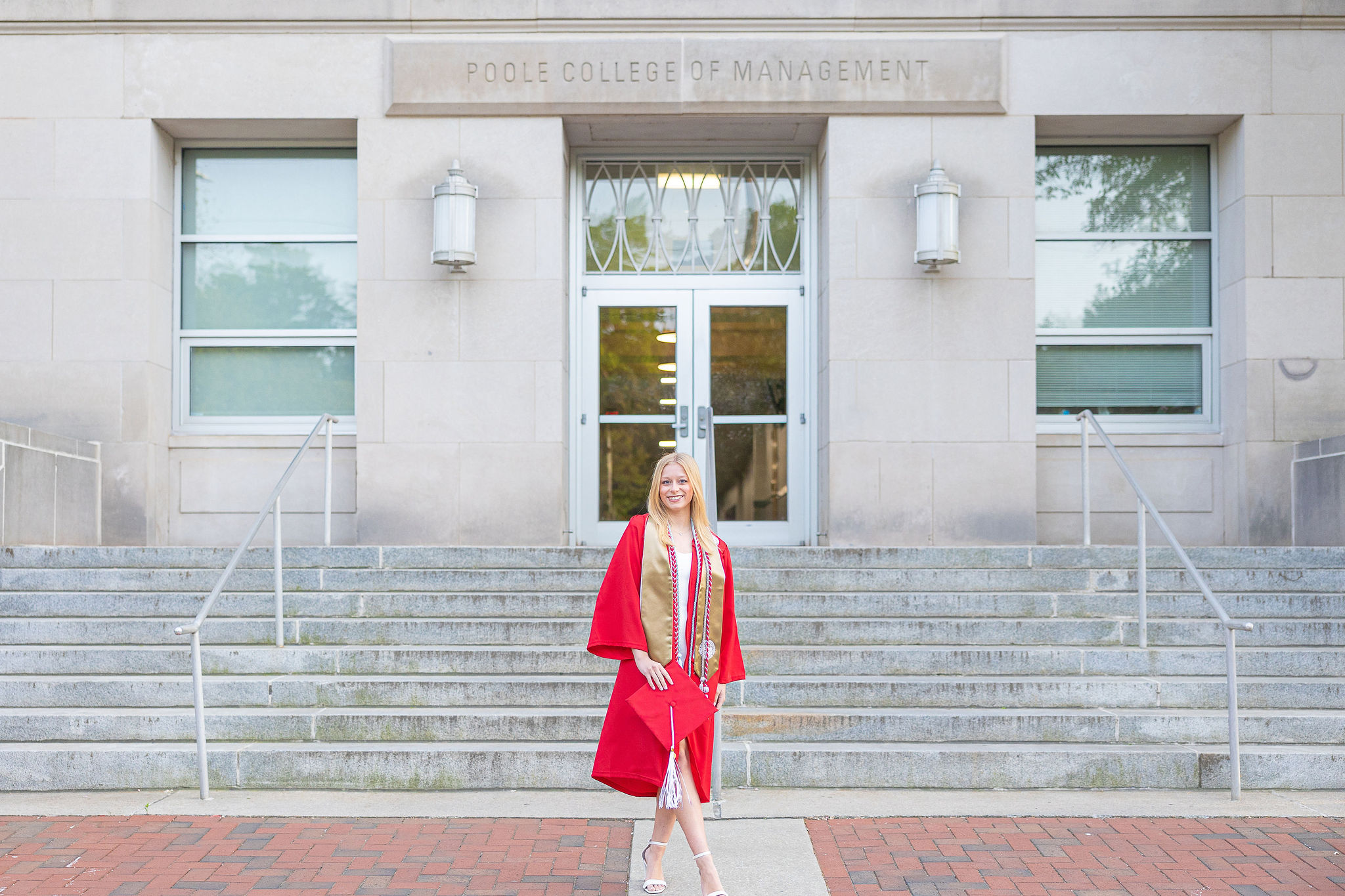 NC State grad in front of the business school