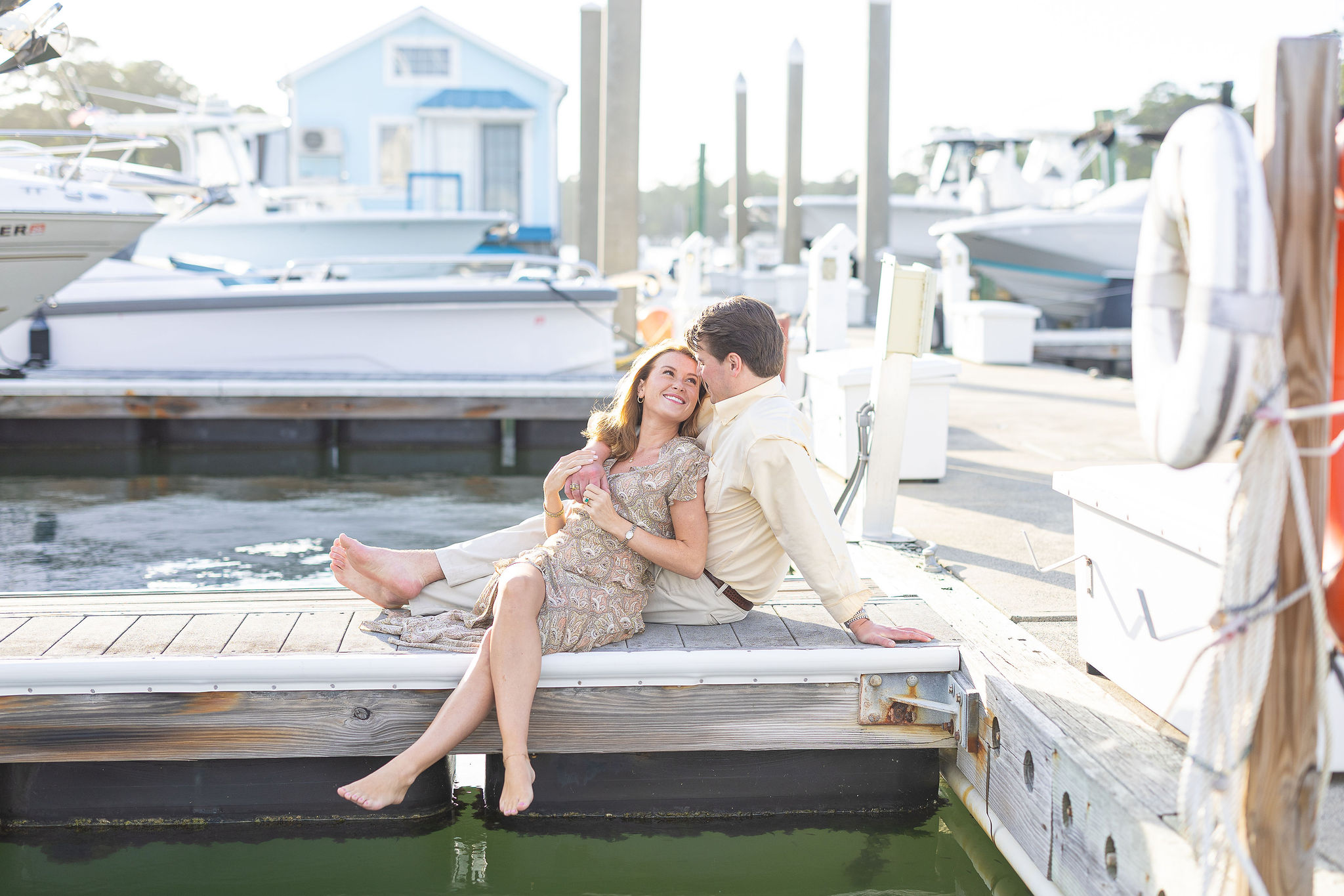Couple sitting on boat dock