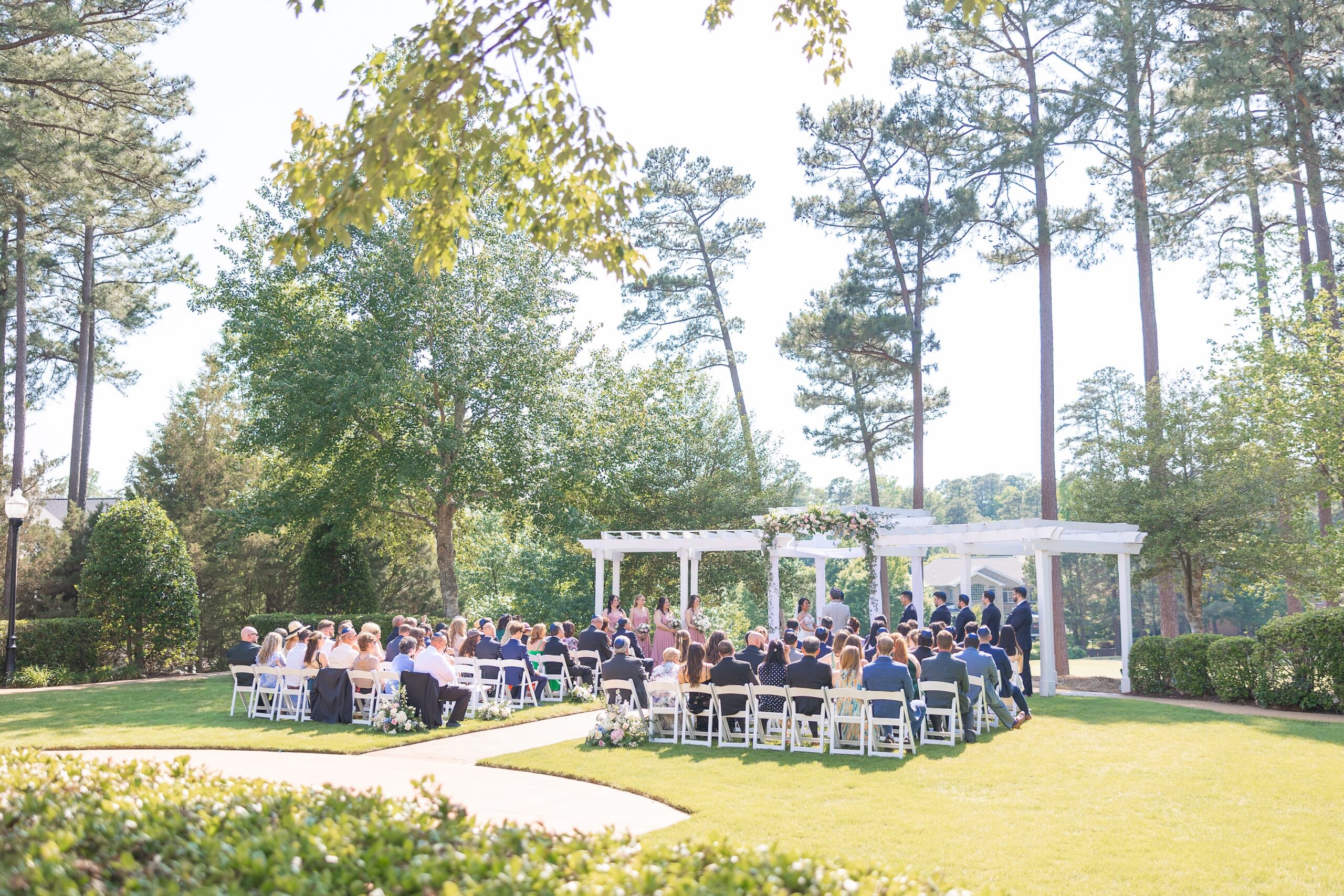 outdoor wedding venue, white chairs on lawn